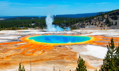 See the Grand Prismatic Spring and other geothermal wonders in Yellowstone National Park, USA.