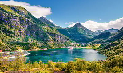 The pretty Geiranger village is surrounded by mountains, waterfalls and the stunning Geirangerford.