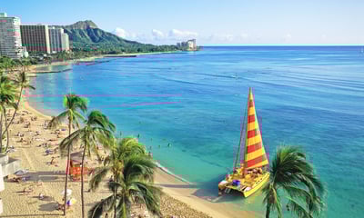Stroll along the world-famous Waikiki Beach, Hawaii.