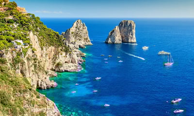 Admire the blue waters surrounding Capri, Italy.