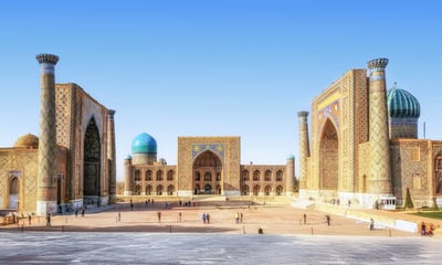 Stand in awe at the turquoise tiles of Samarkand's beautiful Registan Square, Uzbekistan.