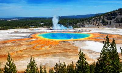 See the Grand Prismatic Spring and other geothermal wonders in Yellowstone National Park, USA.