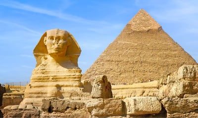 See the iconic Pyramids and the Sphinx in Giza, Egypt.