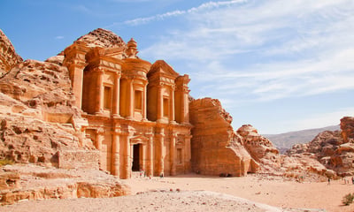 Marvel at the elaborate stone Monastery and Treasury in Petra, Jordan.