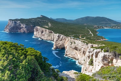 Why We're Loving Sardinia Capo Caccia coast 186 metres above sea level with sea caves. Featured in Bond film, Spy Who Loved Me (1977)