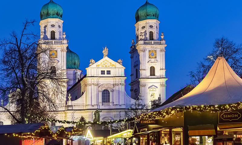 Visit Passau's Christmas markets in front of the magnificent Baroque St Stephen's Cathedral.