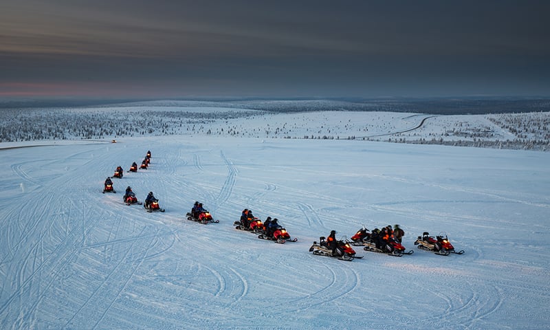 Join the excitement of a snowmobile excursion.
