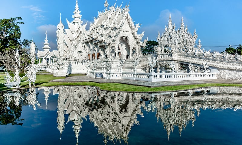 Explore Chiang Rai’s gleaming Wat Rong Khun, a modern marvel of Buddhist artistry.