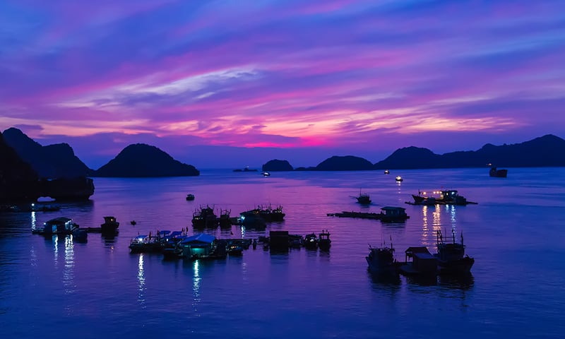 Discover the serenity of a Halong Bay sunset, Cat Ba Island, Vietnam