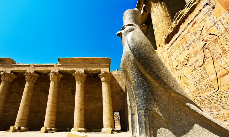 Granite statue of god Horus at the Hypostyle Hall, Court of Offerings, Temple of Horus, Edfu, Egypt.
