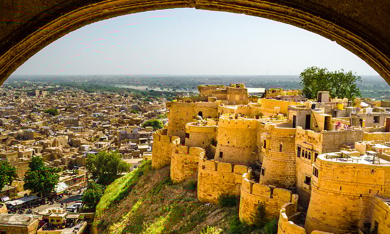 Marvel at the World Heritage Listed fort and surrounding city of Jaisalmer, India.