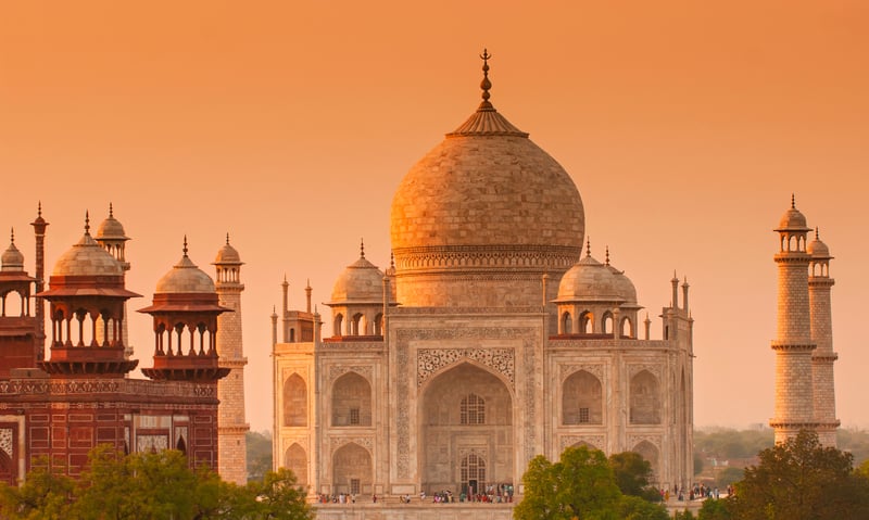 Witness the sunrise over the awe-inspiring Taj Mahal in Agra, India.