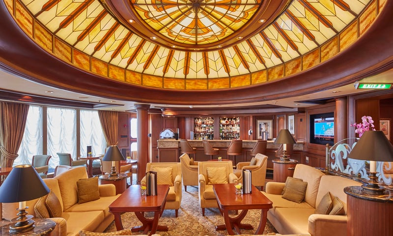 Unwind at one of the many magnificent lounges aboard the Cunard ship.