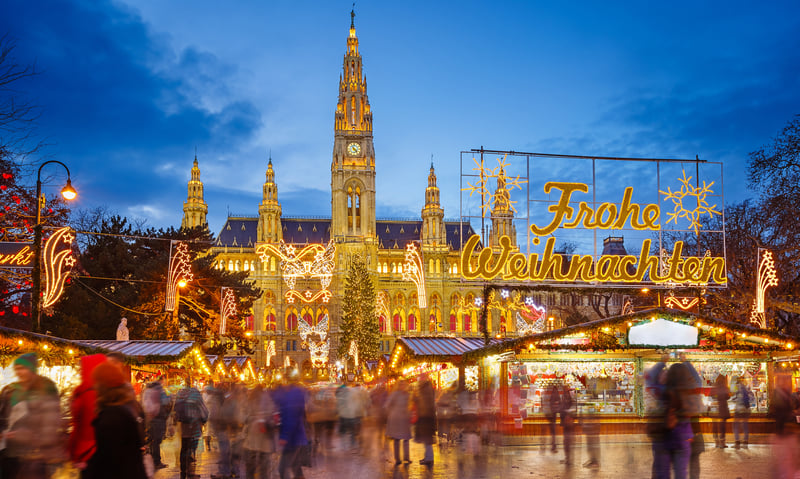 Watch the night come to life at Christmas markets in Vienna, Austria.