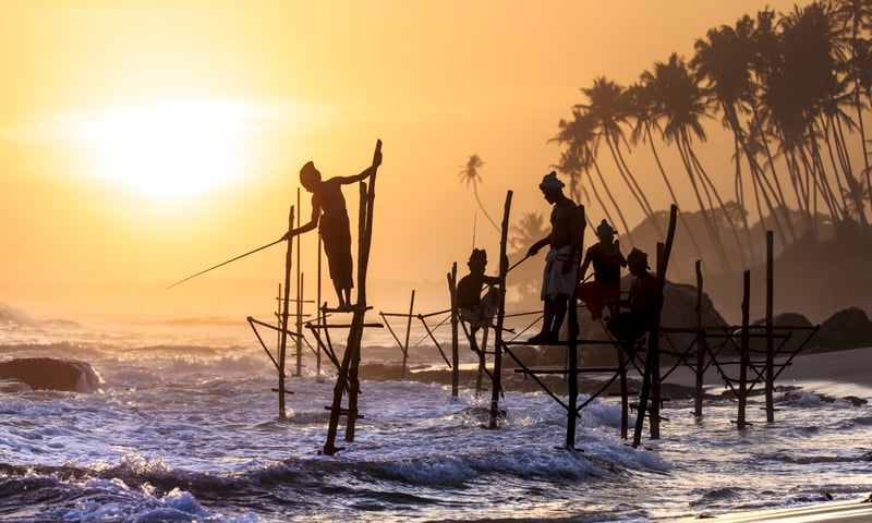 Watch locals fishing as the sun sets in Koggala.