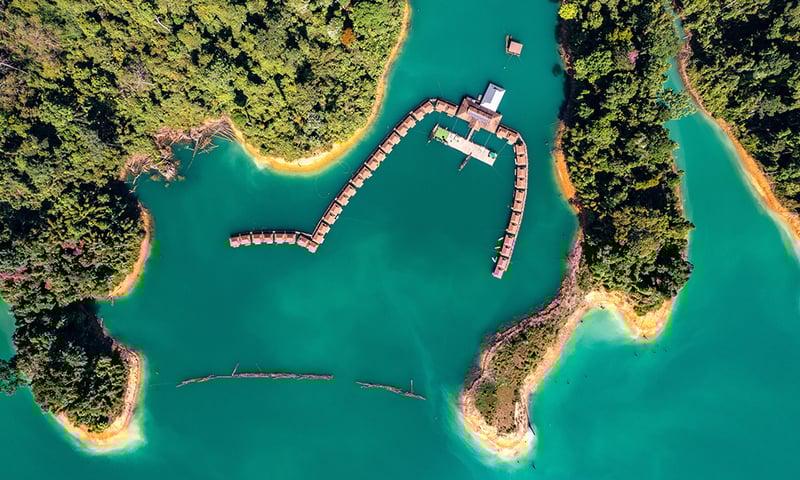 Stay in floating raft houses on Cheow Lan Lake in Khao Sok National Park.