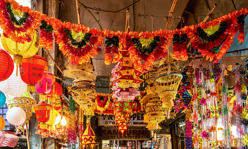 Wander through markets adorned with Diwali decorations in Delhi, India.