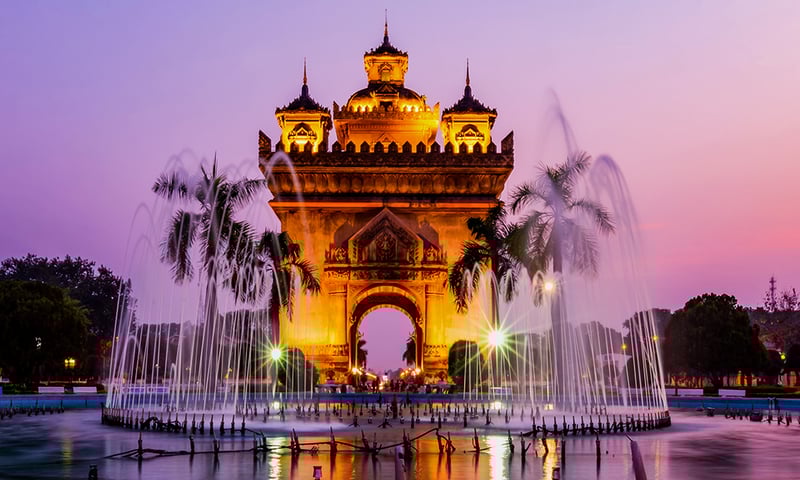 A stunning sunset behind the Patuxay War Memorial in Vientiane, Laos.