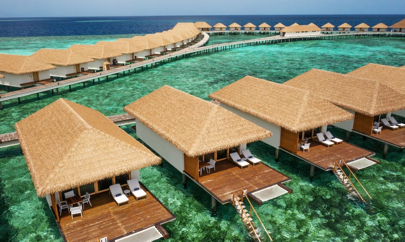Upgrade to an Overwater Bungalow at Cinnamon Velifushi Maldives.