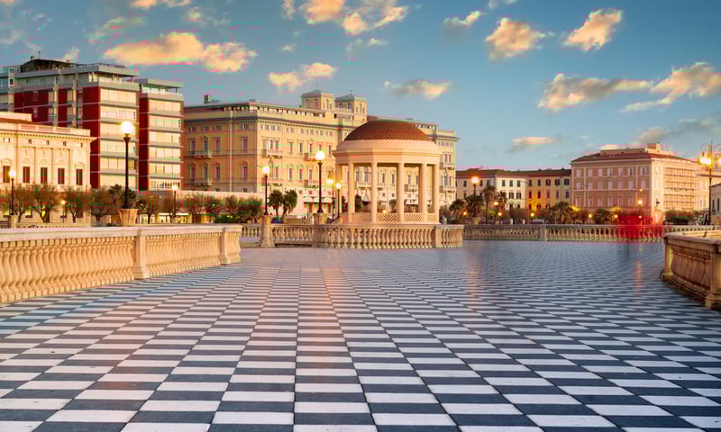 Walk across the checkered terrace of the Terrazza Mascagni in Livorno, Italy.
