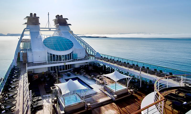 Soak up the sun and take a dip in the pool or hot tub on Seabourn Quest's pool deck.