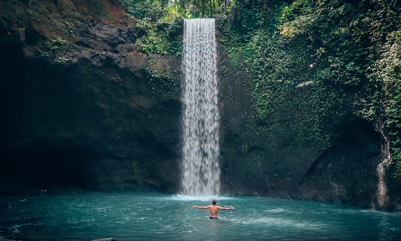Picture-perfect and lush Tibumana Waterfall in Ubud, Bali.