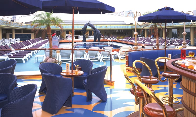 Soak up the sun and treat yourself to a cocktail by the pool, Holland America's Zaandam. Soak up the sun and treat yourself to a cocktail by the pool, Holland America's Zaandam.