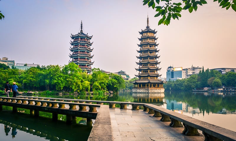 See the Sun and Moon Twin Pagodas at Shanhu Lake during leisure time in Guilin.