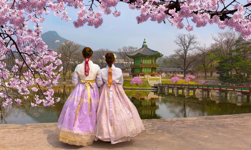 Two young ladies wearing the Korean national dress at Gyeongbokgung Palace in Seoul, South Korea.