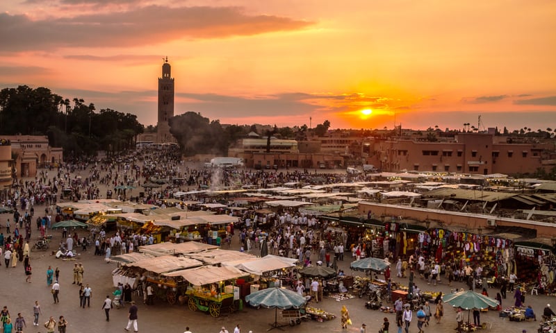 Explore the open-air bazaars at Jemaa El Fna Square in  Marrakech, Morocco.
