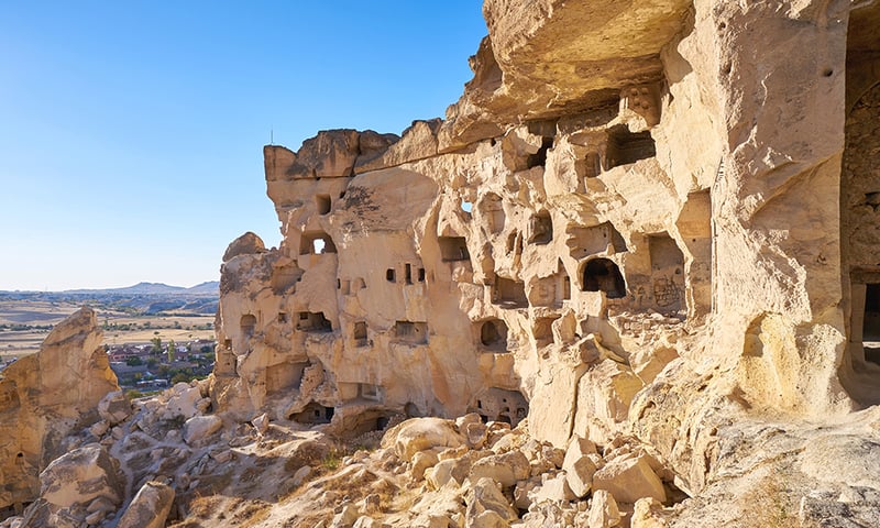 Marvel at the cave houses in the village of Cavusin, Türkiye (Itinerary 2 extension package).