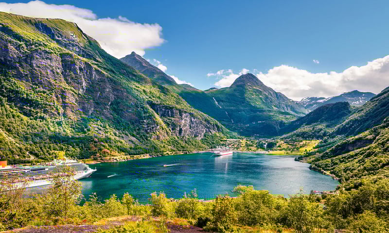 The pretty Geiranger village is surrounded by mountains, waterfalls and the stunning Geirangerford.