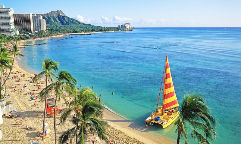 Feel the sand of Waikiki Beach between your toes.
