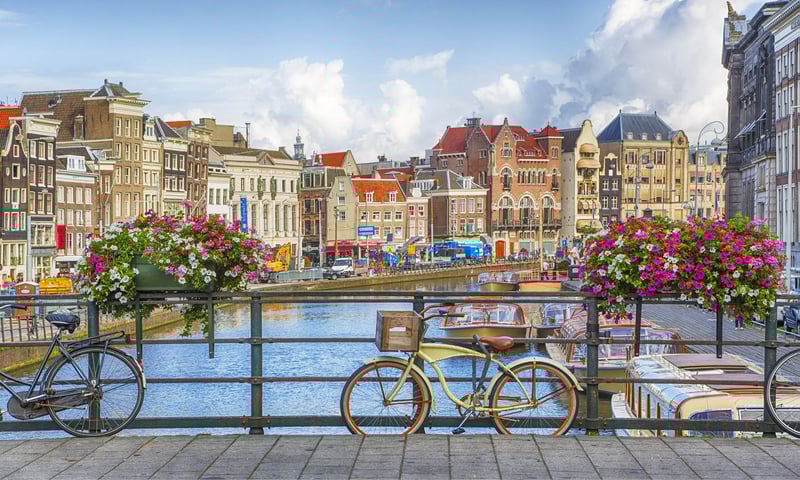 Explore the historic canals of Amsterdam, Netherlands.