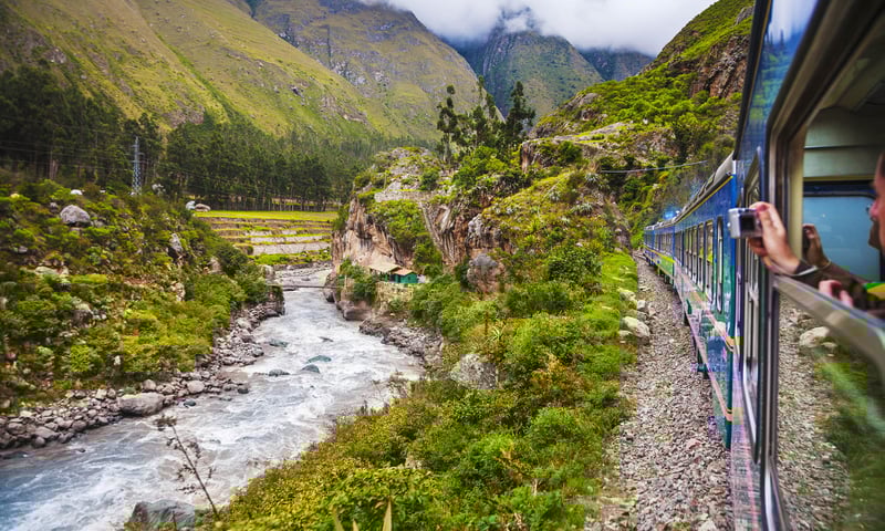 Board the PeruRail Expedition train to Aguas Calientes, Peru.