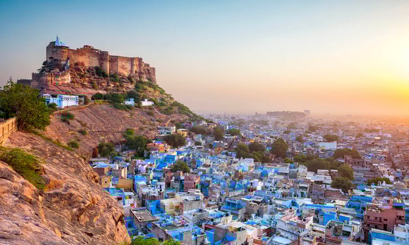 Jodhpur's magnificent Mehrangarh Fort sits high above the blue city, India.