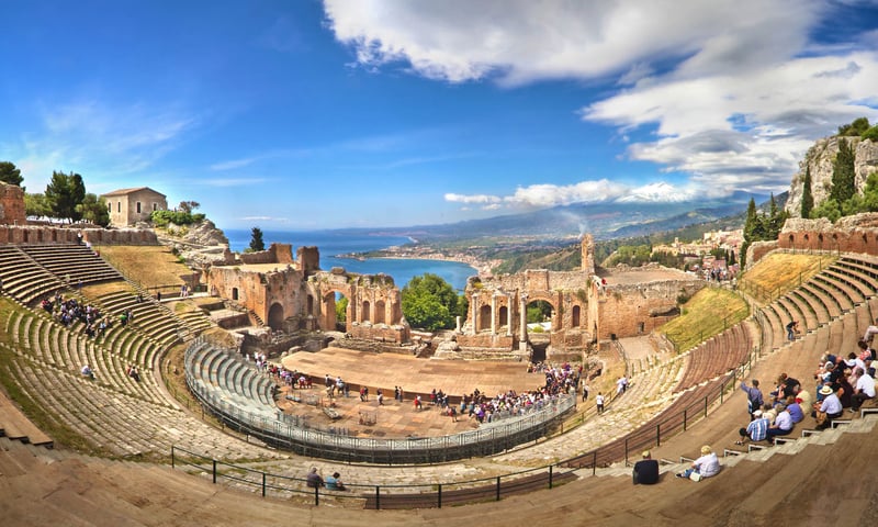 See the Ancient Greek Theatre in Taormina, Italy.