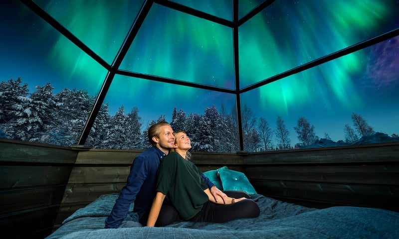 Stay overnight in a glass igloo (or aurora cabin) under the magical arctic skies.