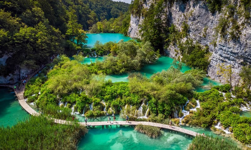 Marvel at the cascading waterfalls of Plitvice Lakes National Park.