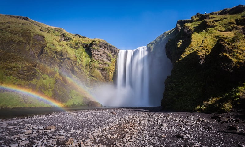 Visit the powerful Skogafoss waterfall.
