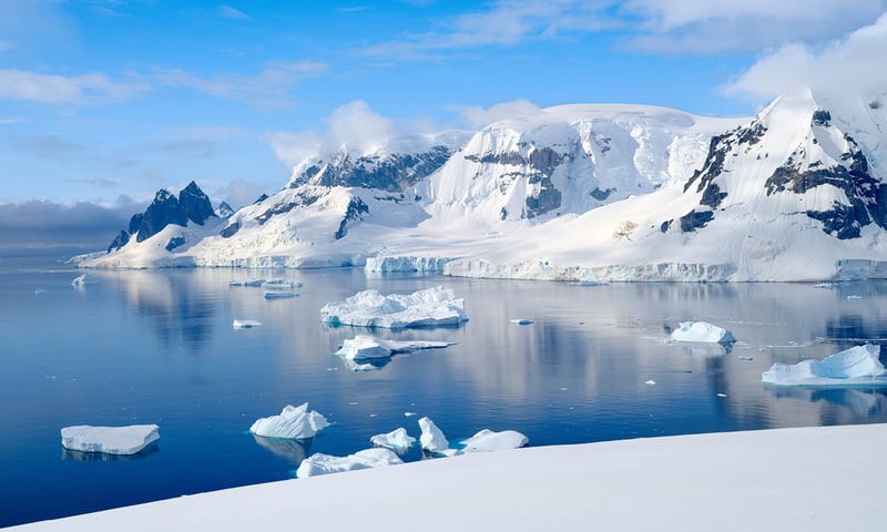 Witness towering glaciers and jagged mountain peaks from Antarctica.