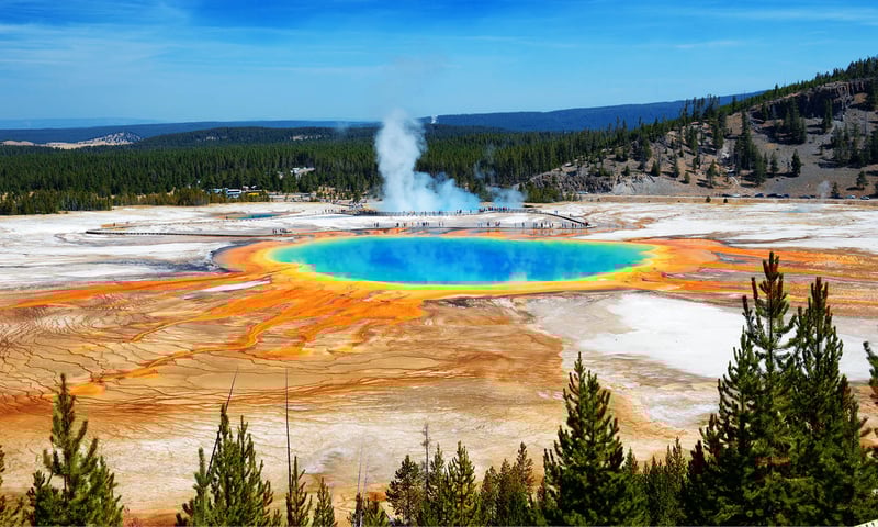 See the Grand Prismatic Spring and other geothermal wonders in Yellowstone National Park, USA.