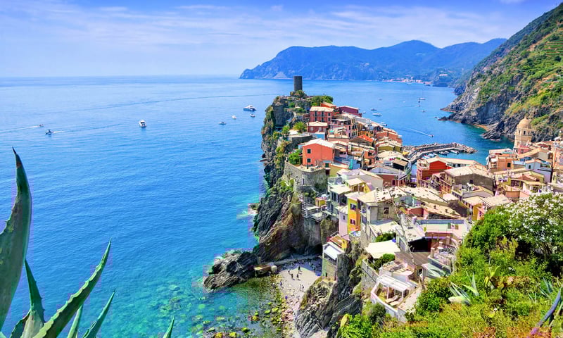 Cliffside vineyards, colourful houses, and  blue waters make Italy's Cinque Terre a must-see.