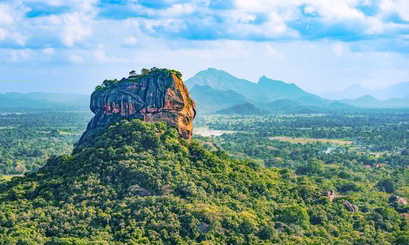 See the imposing Sigiriya Rock Fortress in Sri Lanka.