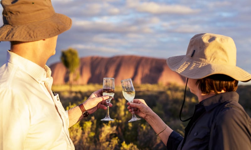 Take in the beauty of Uluru, Northern Territory, Australia, with a refreshing beverage.