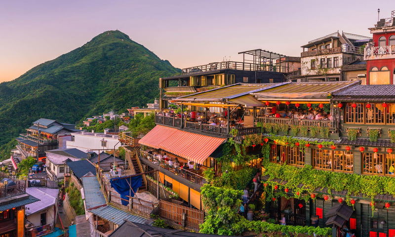 Discover dreamy towns like the beautiful green mountain village of Jiufen, Taiwan.