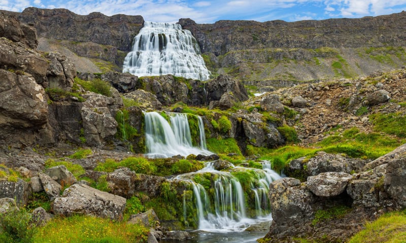 The thunderous Dynjandi Waterfall gives the impression of a flowing bridal veil.