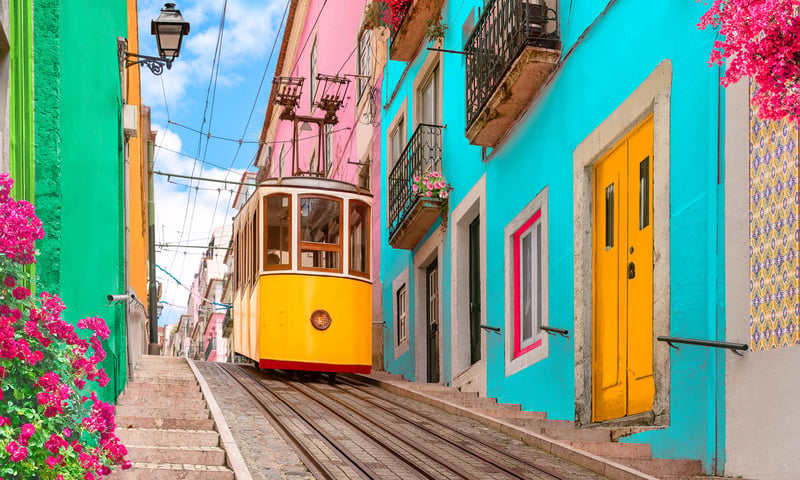 Ride a Lisbon tram during your leisure time in the Portuguese capital, charges apply.