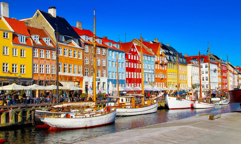Nyhavn is a picturesque 17th-century waterfront, canal in Copenhagen, Denmark.