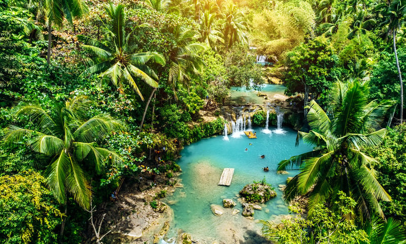 Witness the stunning Cambugahay Waterfalls in Siquijor, the Phillippines.